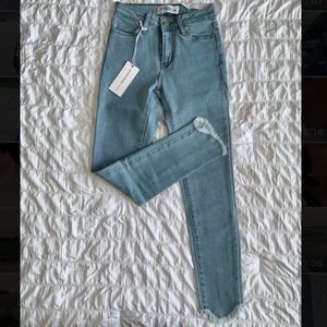 Blue jeans with ripped hem
